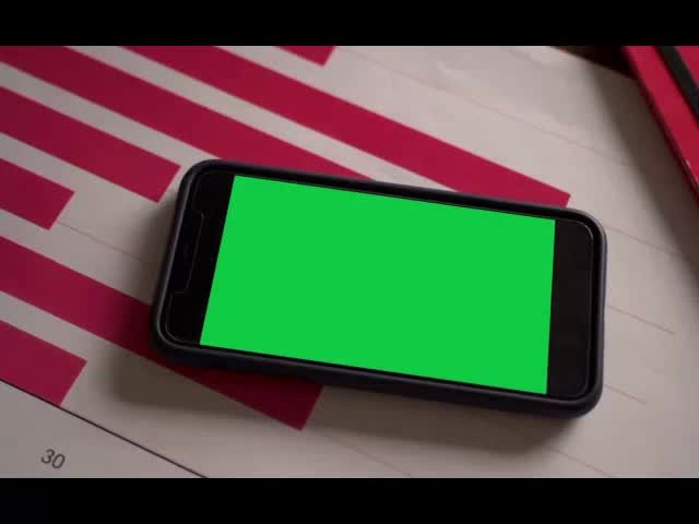 Mobile On Table Green Screen Video preview