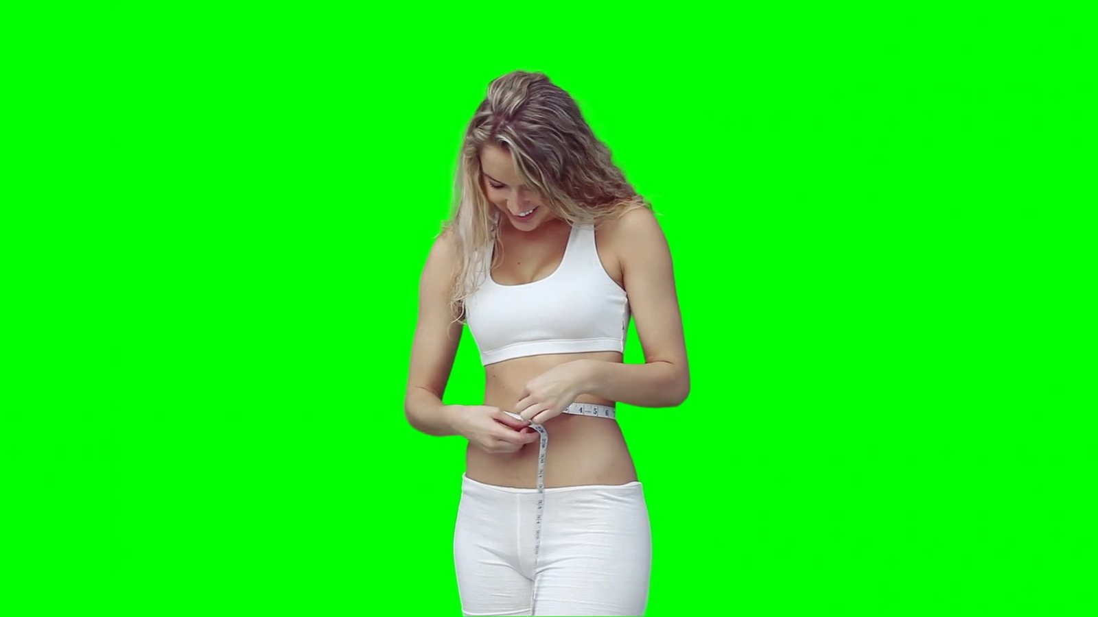 Fit Woman Measuring Waistline in Workout Clothes with Green Screen Background Video preview