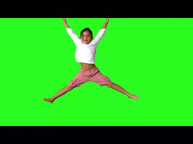 Energetic Young Girl Jumping with Joy on Green Screen Background Video preview
